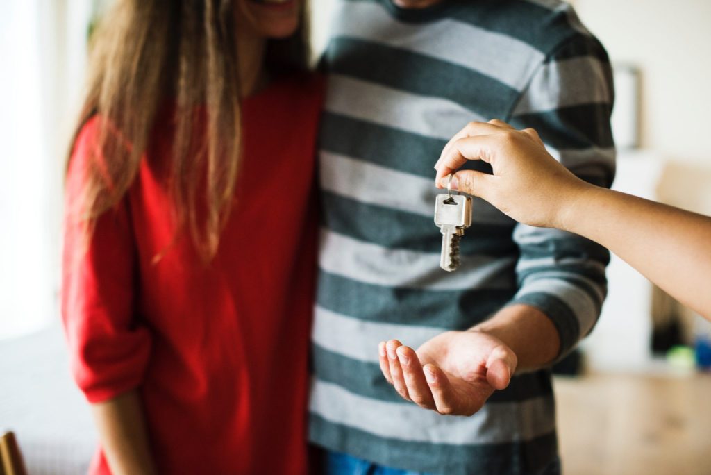 giving house keys to a couple
