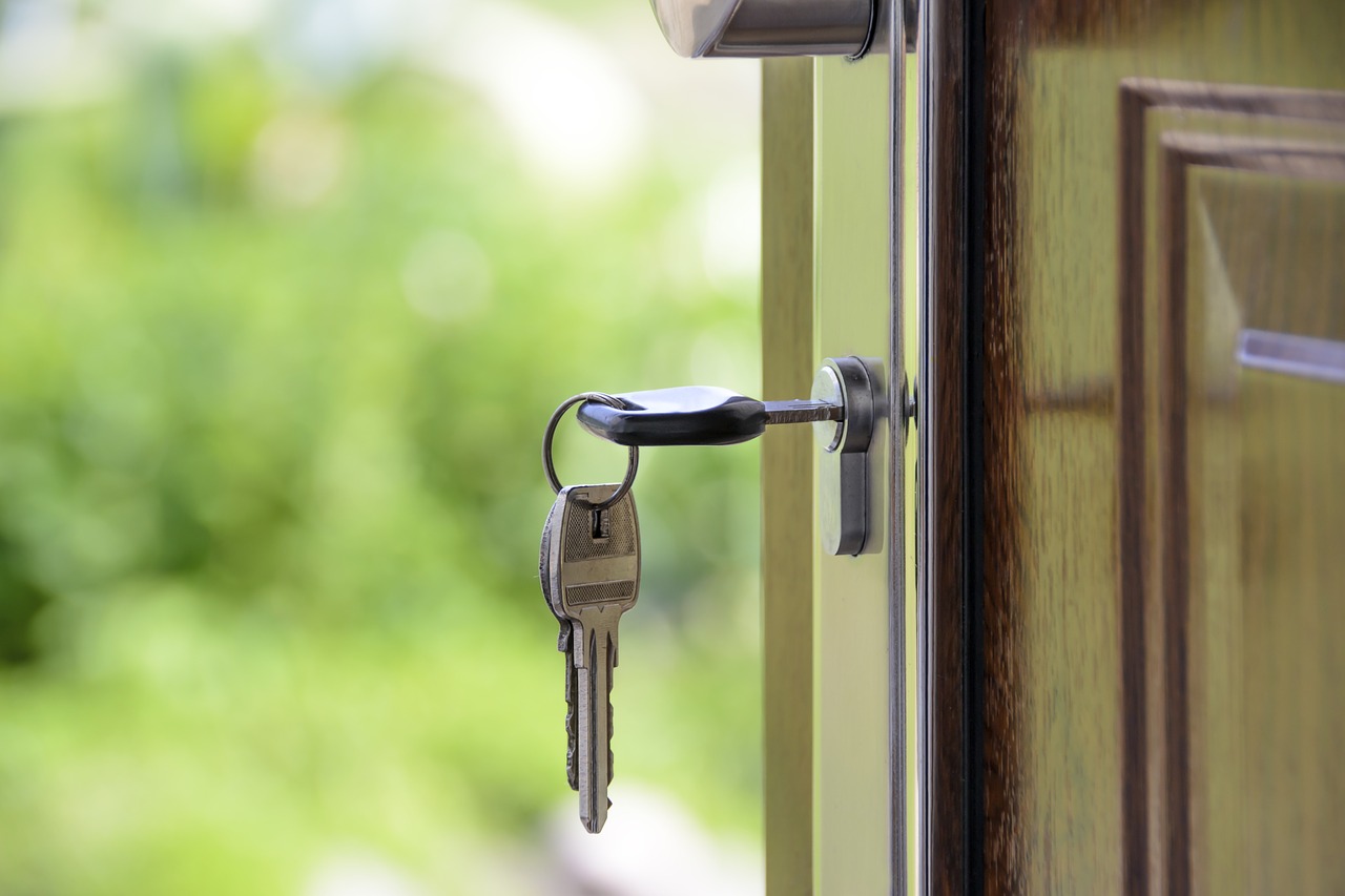 open door with keys in lock pay off your mortgage early