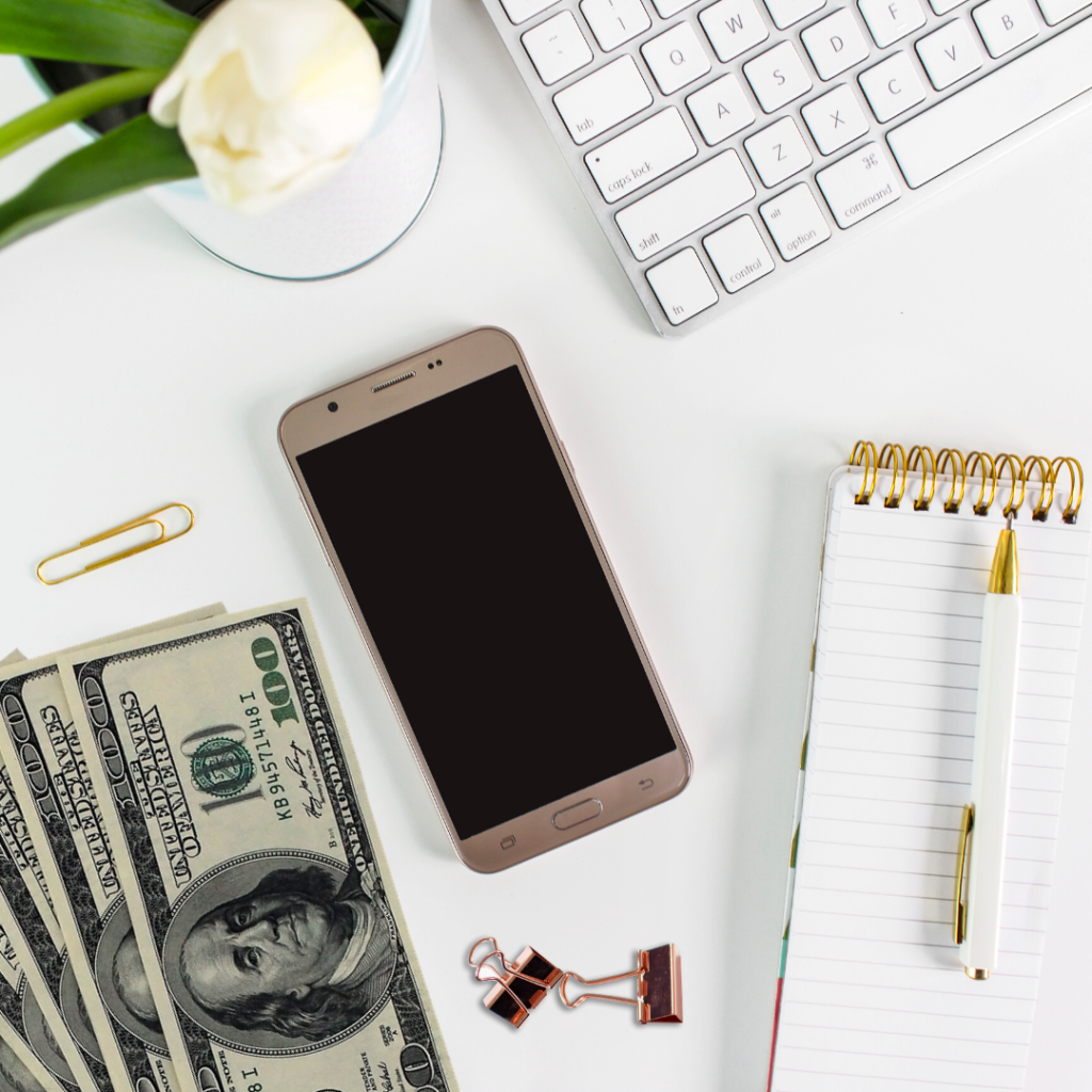 money and phone on desk